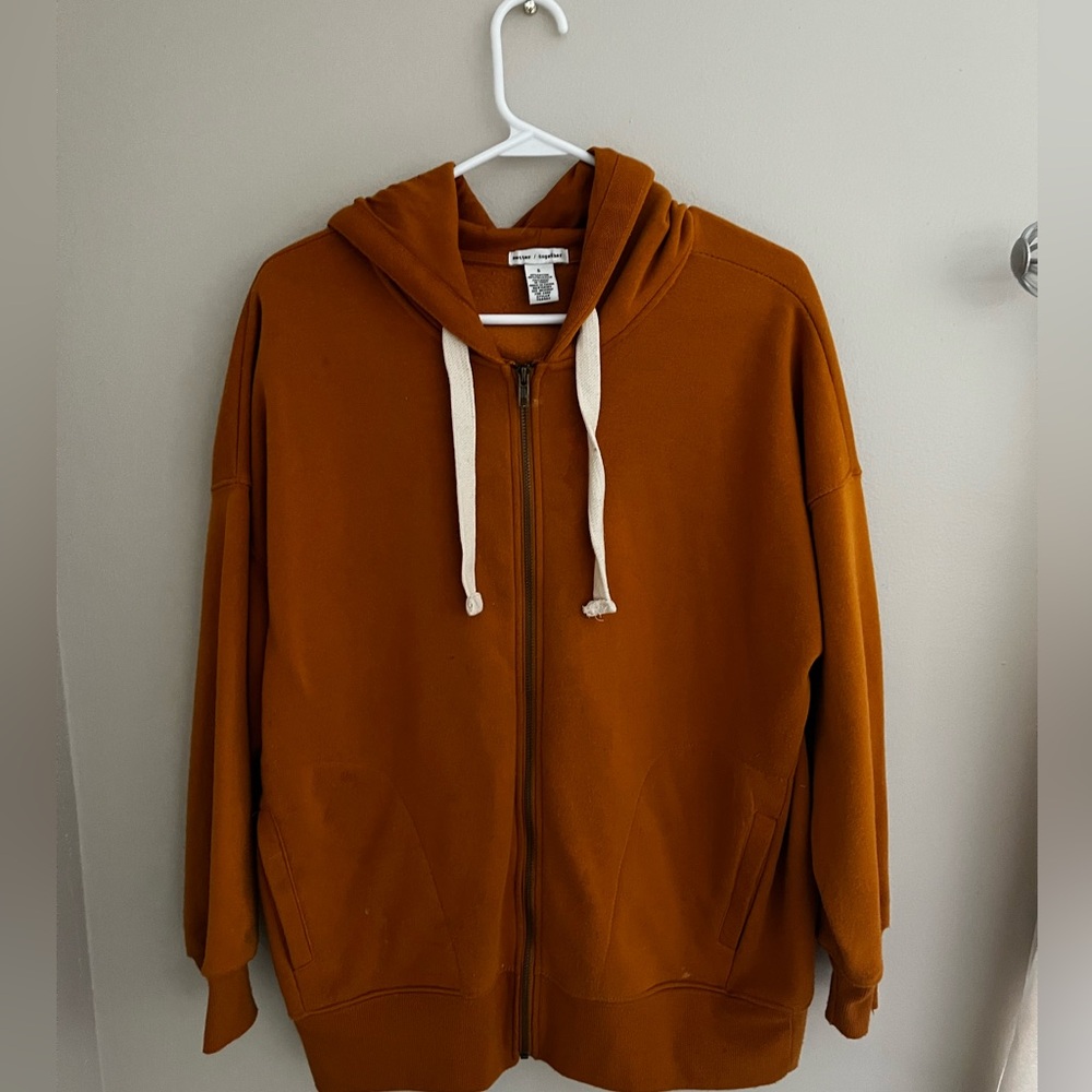 Orange zip up